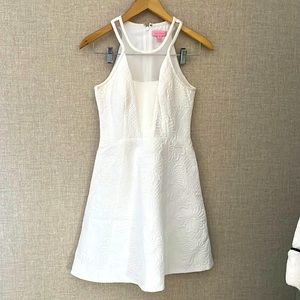 Lilly pulitzer white girls dress size 00. Beautiful sheer neckline and cut.